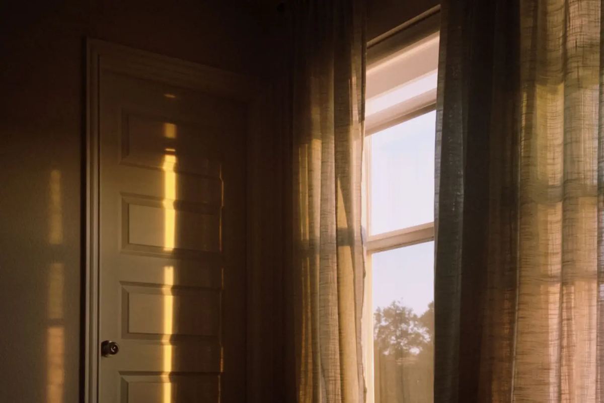 Golden morning light streaming into a quiet room